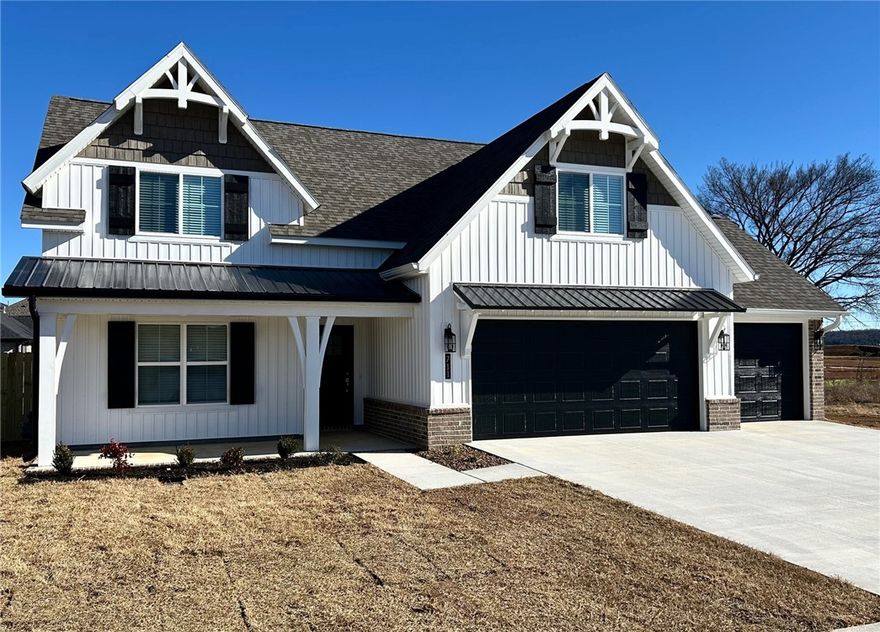 Welcome to Snyder Grove , new construction in sought after subdivision. Cottage style home has 4 bedrooms 2 & 1/2 baths, 3 car garage. Primary bedroom is downstairs w/ ensuite-Large dual head walk in shower, split vanities, private toilet room & walk in closet. Open floor plan living area has upgraded LVP  & electric brick fireplace. Kitchen has a large island & cabinetry is custom made w/ soft close drawers & doors , countertops are upgrade Milano Quartz. Large Pantry/Laundry room w/  shelving and adjustable cabinet stack for all your cooking appliances. 1/2 bath downstairs for your guests.  Upstairs you will find 3 large bedrooms , 1 full bath and an extra space that is ideal for small office, play area, hobby or craft room. A walk-in attic, no more climbing up those pull down stairs! The popular Fantasy Brown granite countertop is in all wet areas. No HOA. Get away from all the crazy and come relax in Prairie Grove. Close to the PG water park, take a nice stroll through Battlefield Park, enjoy shopping downtown!