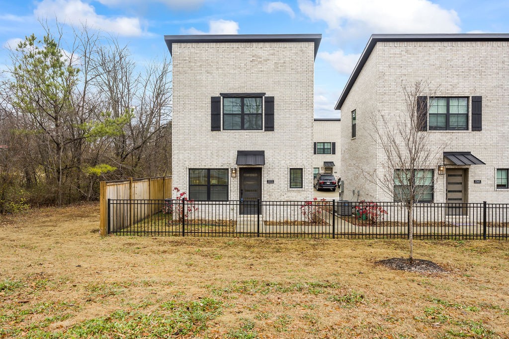 This charming, one year old, all brick detached townhome is like new and is the perfect Fayetteville getaway! This cozy home is in the heart of all that is Razorback country, located just down the street from Baum Stadium and the south entrance to the University of Arkansas campus. The Razorback Greenway Trail system is also steps away for easy access! The main level features an open concept living area with extra seating at the bar and a 1/2 bath for guests. Keeping your living quarters private, the upstairs features two bedrooms and a full bath. Heating and cooling is a breeze. Two parking spaces are located in the back of the home. Yard maintenance is provided. Wired for a security system. Successful Air BNBs are in the area, making this a great place for a rental as well. One year old Refrigerator, washer, and dryer convey!