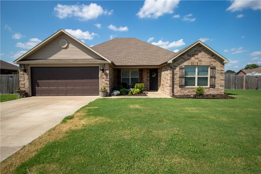 Beautiful and well maintained 4 bedroom 2 bath home located in Elkins.  Home boasts a spacious and open living area - great for entertaining - and an electric fireplace in a custom built mantle.  Brand new luxury vinyl plank floors - just installed July 2024 - throughout the main living areas.  Split level floor plan with a large primary bedroom with tray ceiling.  Home sits on a huge corner lot with backyard fully fenced for privacy.  There are endless opportunities for outdoor entertaining with the space this yard offers!  Located just minutes from grocery stores, restaurants, shopping, and schools and only 15 minutes from Fayetteville.  Don't miss out on this great, turn-key home located in Elkins - Call for your showing today!