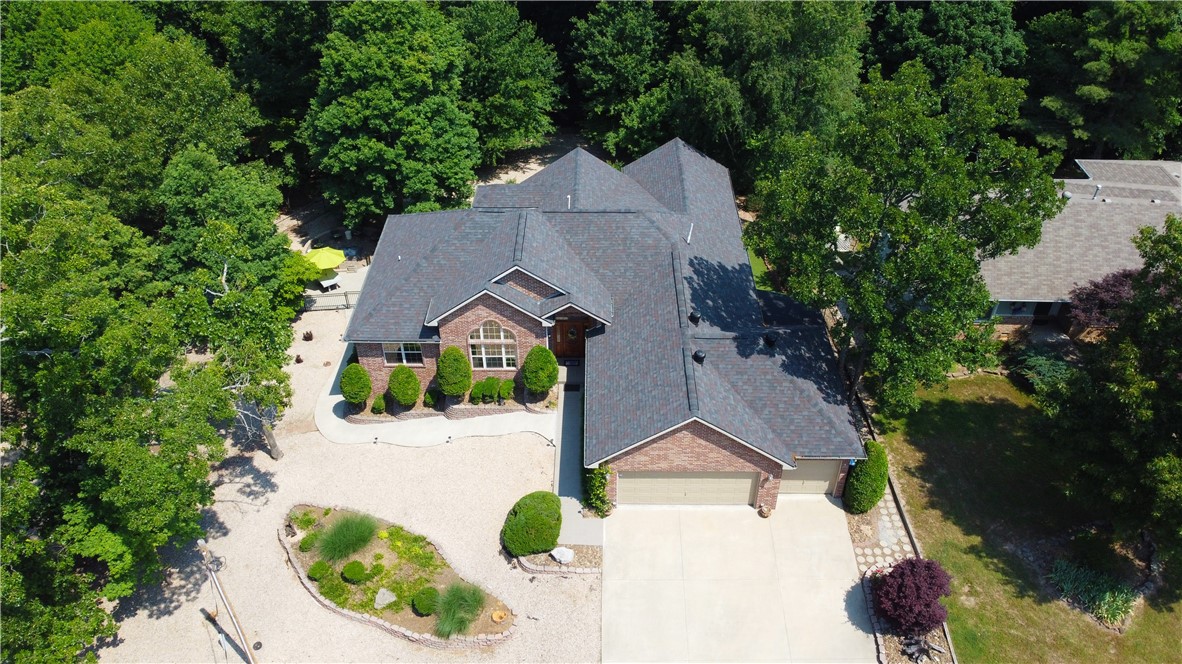 Impeccable, one-of-a-kind, and peaceful are just some of the ways to describe this property. Sitting on a beautiful .88 acre lot (3 lots combined) provide amazing views and privacy on this house. 1 traditional elevator, 1 seated elevator to the loft, 2 screened-in patios/dens with custom shades, sauna, and massive amounts of storage space are a few ways it sets itself apart from the rest of the market. Lovely dining, living room with a ton of light inside with massive windows to enjoy the views. Rock and hardscape landscaping is extremely low maintenance. The backyard space is senere and an entertainer's delight with multiple areas to enjoy. The 3rd car garage space has been converted into an office/music room and could easily be converted back into a garage area. If you're looking for a home that's unique and checks all the boxes, this is the one! HVAC- May 2023, Roof 2021, 80-gallon hybrid water heater- 2 years old.