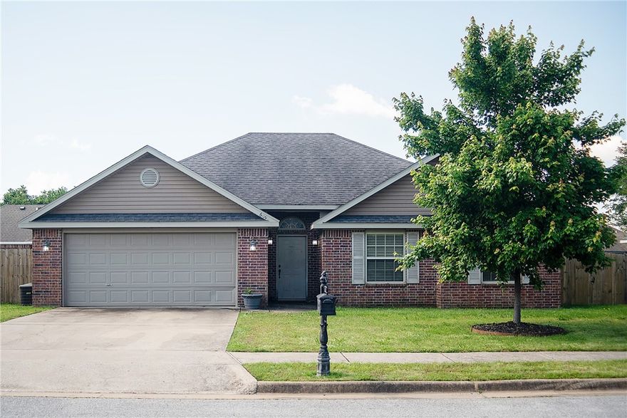 Welcome to this well-maintained, 3 BR, 2 Bath home built in 2009.  This inviting property features an open floor plan perfect for both everyday living and entertaining.  Enjoy the comfort of a large living area and kitchen that features a dedicated dining area.  The master suite includes a private bath and generous closet space, while the two additional bedrooms are perfect for family, guests, or a home office.  Step outside to a fully fenced backyard – ideal for pets, play or relaxing weekends.  The home also includes a two-car garage offering extra storage and convenience.  Home is located close to both US 71B and AR 264, offering easy access to shopping, dining, and Northwest Arkansas traffic arteries.