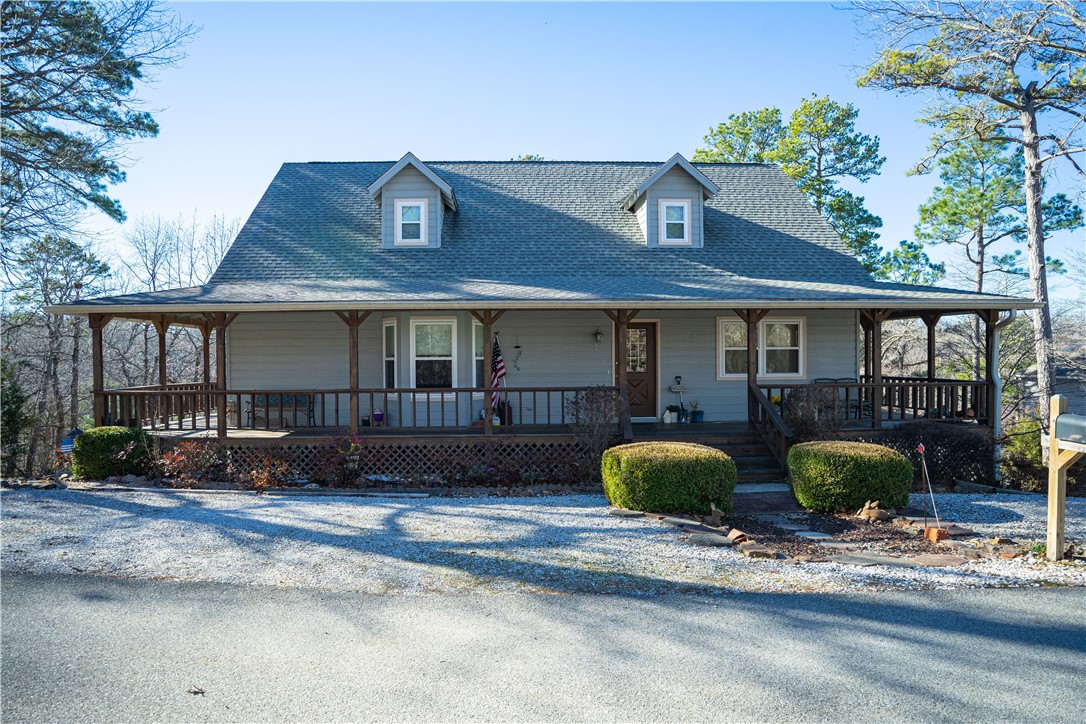 Looking for a lake view that's close to all of the amenities of Downtown Rogers. This lakeside cottage has a wraparound porch to take in the beautiful view of Beaver Lake. Great size for either a 2nd home or a primary residence w/ 3 bedrooms & 2.5 bathrooms. Finished area in basement for a separate office. This home is ready for your personal touch to make it a fantastic lakeside retreat. Prairie Creek, Hobbs State Park, Lake Atalanta, & Rocky Branch are all close by.