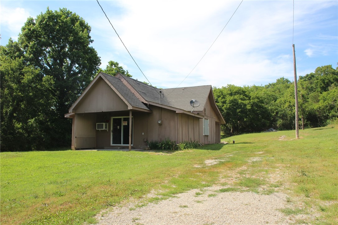 Looking for a project house? The sellers have done all the tear out and clean up on this one. Ready to put back together to your taste. This home has a large yard with over 1/2 acre M/L. Storm shelter and parking on side of home. Conveniently located to walk to school or town.