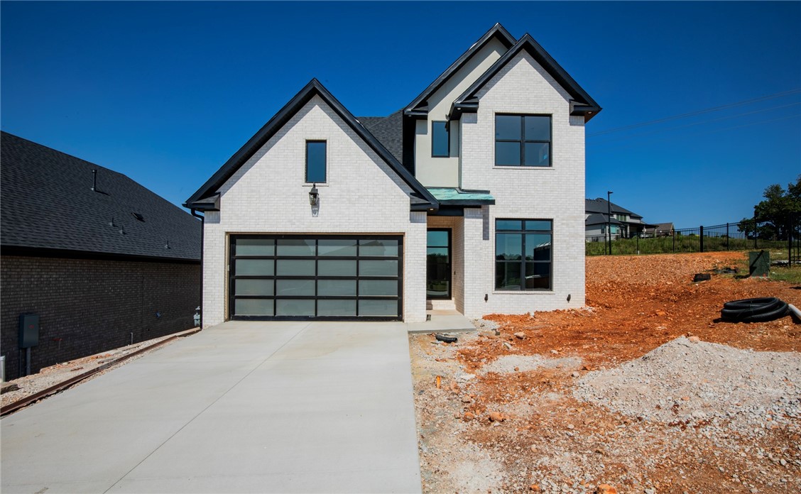 This is one of the last three homes built by Lance Johnson Building Company in the prestigious Phase 11 of Shadow Valley—don’t miss your chance to own a piece of luxury in one of Northwest Arkansas’s most sought-after gated communities. This stunning two-story home features 4 spacious bedrooms, 3 full bathrooms, a versatile bonus room, and high-end finishes throughout. The open-concept layout is designed for modern living, with thoughtful details, elegant touches, and quality craftsmanship you can feel. Step outside to your covered patio—complete with an outdoor grill—perfect for entertaining year-round. From quiet mornings to evening gatherings, this space makes outdoor living effortless. With access to top-tier community amenities including the golf course, clubhouse, pool, tennis and pickleball courts, and more—this home is more than just a place to live. It’s a lifestyle.