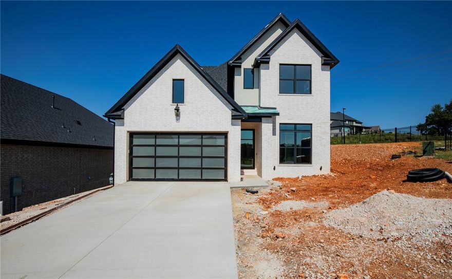 This is one of the last three homes built by Lance Johnson Building Company in the prestigious Phase 11 of Shadow Valley—don’t miss your chance to own a piece of luxury in one of Northwest Arkansas’s most sought-after gated communities. This stunning two-story home features 4 spacious bedrooms, 3 full bathrooms, a versatile bonus room, and high-end finishes throughout. The open-concept layout is designed for modern living, with thoughtful details, elegant touches, and quality craftsmanship you can feel.  Step outside to your covered patio—complete with an outdoor grill—perfect for entertaining year-round. From quiet mornings to evening gatherings, this space makes outdoor living effortless. With access to top-tier community amenities including the golf course, clubhouse, pool, tennis and pickleball courts, and more—this home is more than just a place to live. It’s a lifestyle.