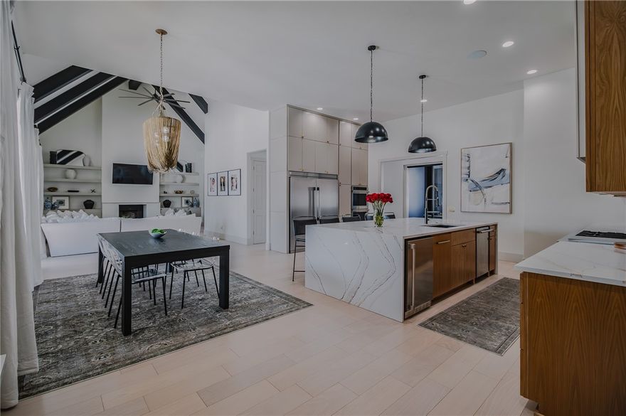 Nestled on a sprawling, tree-lined lot, this beautifully updated 4-bedroom, 3.5-bath home epitomizes modern elegance within the exclusive gated Pinnacle subdivision. Designed to harmonize style and function, the first floor boasts an open-concept living and dining area graced with soaring ceilings, abundant natural light, custom built-ins, wooden beams, and a cozy fireplace. The chef's kitchen is a culinary dream, featuring a stunning waterfall quartz island, custom white oak cabinetry, premium appliances, and a walk-in pantry. The primary suite presents a spa-like ensuite with a double shower, soaking tub, dual vanities, an additional makeup vanity, and an expansive closet. An office with large windows and a media room equipped with a fireplace and wine bar add to the home's allure. Upstairs, three spacious bedrooms and a dedicated play area/flex space offer versatility and ample storage. Enjoy ultimate privacy in the tranquil backyard, perfect for entertaining or designing a custom pool. Agent owned.