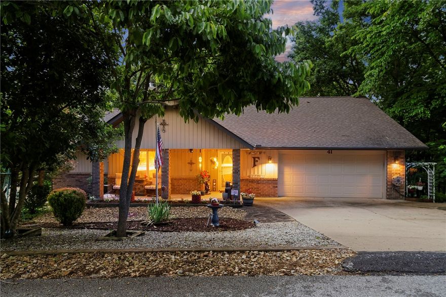Looking for privacy, flexibility, and room to grow? This move-in-ready Bella Vista retreat includes two parcels totaling .55 acres, including an adjacent buildable lot with perc test and septic design already completed. Fresh paint, updated kitchen and baths, newer roof and HVAC, Pella windows, and luxury vinyl plank flooring throughout mean little left to do but move in. The flexible single-level floor plan offers 3 bedrooms, multiple living spaces, a split-bedroom layout, and an unfinished basement for storage. The trayed-ceiling living room features a fireplace and opens to a bright four-season sunroom overlooking a wooded setting that feels like living in a treehouse. Enjoy the private deck and hot tub that conveys. The additional lot provides lasting privacy, RV/trailer parking potential, and space for a future workshop or detached garage. Near Lake Windsor, golf, trails, and the OZ Bike Park.