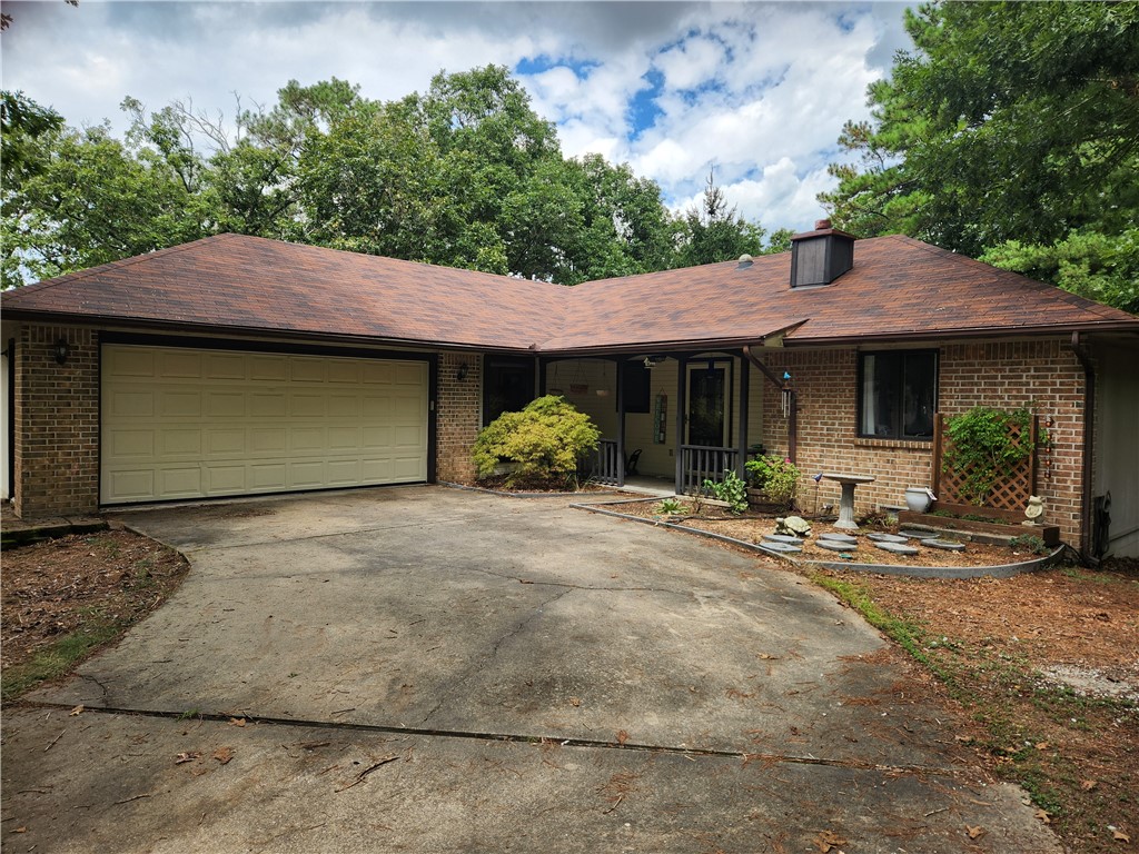 Beautiful home in the heart of beautiful Bella Vista! Less than 300 yards to the back forty trailhead. 2 roomy bedrooms on the main level with 2 full bathrooms. Flex area (on the basement level) could be used as a third bedroom. It has a full bathroom with its own door separating it from the main level and a door to the outside. There are 2 stand up showers and one shower/tub combo. Open living space with beautiful, exposed wood beam and built ins. Enclosed sunroom leads to the open deck overlooking the wooded views. The kitchen has an abundance of cabinet space and countertops. Updated appliances with the refrigerator to convey. Fully fenced backyard overlooking the woods and the trail. 16x10 workshop on basement level. Home is on a quiet cul de sac. Be a part of the growing Bella Vista community! Priced to sell, schedule your showing appt today!