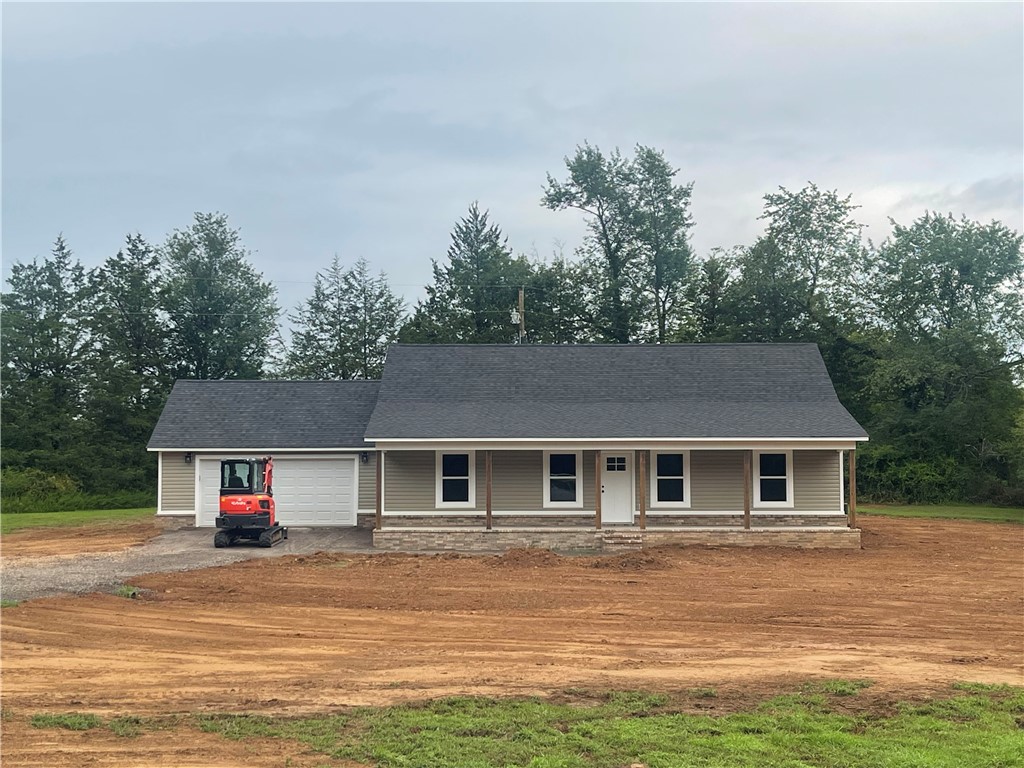 NEW CONSTRUCTION! Another fantastic creation by this experienced, well-known contractor. Gorgeous country setting in the beloved Woodland community--offers 3 acres! Winning floor plan hosts the "open concept" living room/kitchen/dining area- featuring an airy living room. Stunning kitchen has stainless steel appliances and granite countertops. Stunning walk in shower in the primary bedroom. Clean lines, solid construction, one year BUILDER'S WARRANTY. Serene, wooded setting on 3 acres of gorgeous terrain. Quiet, country living in a brand new dwelling--what is not to love! Deed restrictions are in effect. Please ask for a copy. Copy of plat can also be furnished. Tract 6.