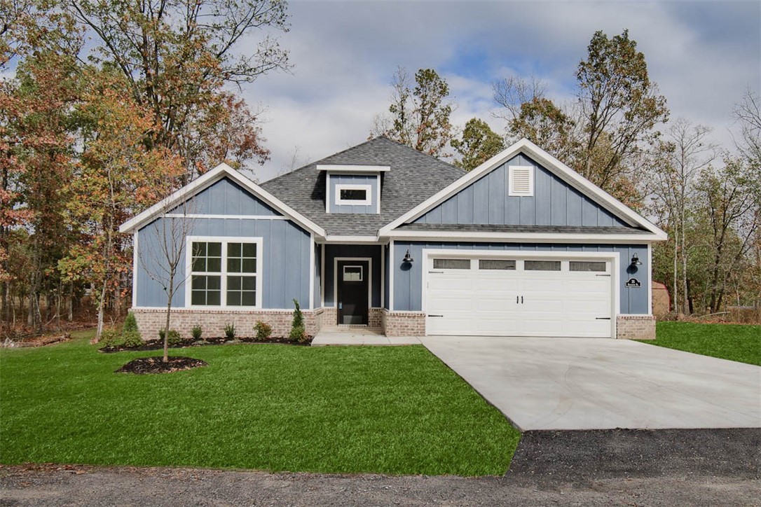 This brand-new construction boasts a completely flat .32 acre lot, offering a huge back and side yard perfect for outdoor living. Imagine the possibilities ā plenty of space for a storage shed or in-ground pool. Located minutes from Lake Loch Lomond boat launch, Highlands Golf Course, & I-49. The home is adorned with upgraded finishes throughout, including a large covered patio, 10-foot ceilings in the living area, custom cabinets, and sleek black stainless steel appliances. The chef in you will love the gas range and the elegant 3 cm countertops, complemented by a large walk-in pantry for all your culinary needs. Cozy up by the fireplace in the living room, or retreat to the primary suite, which features a luxurious walk-in tile shower and generous closet space. As an added bonus, this home includes $3,000 in buyer's closing costs when you use the builderās preferred lender. RD (100% financing) eligible.