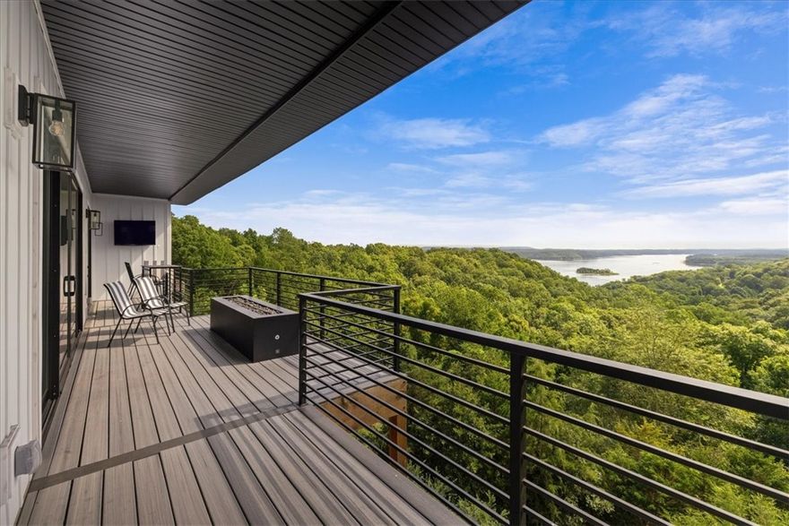 Prairie Creek Marina is just a golf cart ride away. This custom-built home offers stunning lake views across three levels and is packed with high end luxury finishes. It includes 5 bedrooms and 4.5 bathrooms, allows with a bunk room, three living rooms, making it ideal for families or large gatherings. Furniture can convey with acceptable offer. 
The upper level features a gourmet kitchen equipped with GE Cafe appliances, perfect for cooking and entertaining. The middle floor boast a custom bar, enhancing the entertainment options. The third level can be closed off for privacy, making it perfect for an owners retreat while Airbnb the top 2 levels or use it as a mother-in-law suite. This level includes a full kitchen, full laundry and incredible views. 
No expense was spared in the design of this home. The custom bunk beds features trim that matches the decor in bedrooms creating a cohesive look. Additionally, each bunk is equipped with night light for reading and convenient outlets for charging devices.