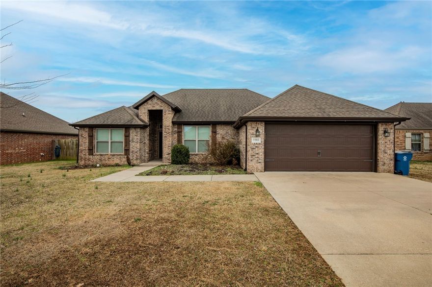 Located in the heart of Bentonville, this pristine brick home offers unbeatable proximity to the Walmart Home Office, making it a premier choice for those seeking a short commute and a high-quality lifestyle. The interior is defined by a spacious, open-concept kitchen featuring premium granite countertops, rich wood cabinetry, and a sleek tile backsplash. Stainless steel appliances and a gas range provide a high-end cooking experience, while the breakfast bar overlooks a bright, versatile dining space perfect for hosting.

The primary suite serves as a true private retreat, complete with an elegant tray ceiling and a massive walk-in closet featuring custom built-in shelving. In the ensuite bathroom, you'll find a dual-sink granite vanity, a deep soaking tub, and a separate glass-enclosed shower with custom tile work. With its neutral color palette and durable wood-look flooring, this home is a perfect move-in-ready opportunity in one of Northwest Arkansas's most sought-after locations.