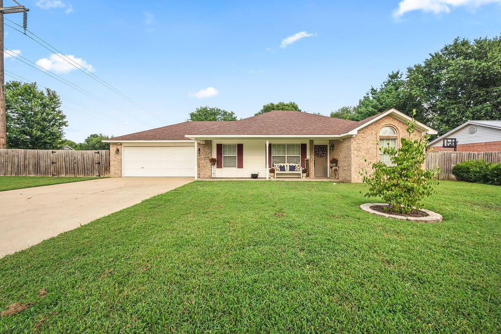 Prime location close to schools and shopping! This well maintained 3 bedroom, 2 bath home sitting on a large corner lot (.33 of an acre) has an additional flex space, perfect for an office or play room! No carpet throughout the home makes clean up a breeze! There are many updates both inside and outside of the home. Some include new lighting fixtures and dishwasher in the kitchen. The roof was replaced in 2021. The HVAC and water heater were replaced in 2024. The beautiful backyard includes a patio with a gazebo for entertaining, a 10 by 10 storage building, and plenty of room for games or gardening. This home does qualify for a Rural Development Loan!!!