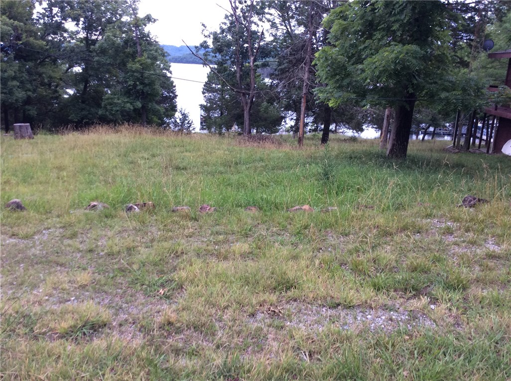 Lakefront partial Lakeview lot located at the swimming pool and recreation center. This is the only lot I know of for sale located Lakefront in Lost Bridge Village. This lot is located in an ideal location. Are you a Pilot? We have a private airstrip. Fly your plane in and walk down to your lot/new home. No boat slip.
A NEW MODULAR HOME can be placed on this lot.