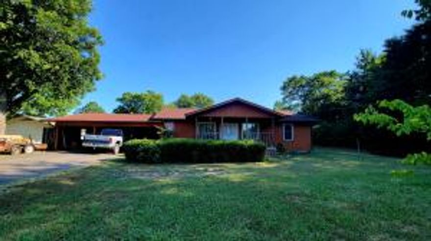 3 Bedrooms,2 Bathrooms, on .94 of an acre.Fenced backyard for dogs, Storm Cellar and Shop area off of carport