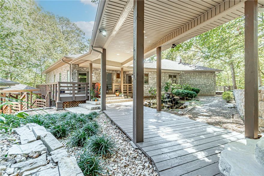 Showstopping custom home on 2.34 acres! This sprawling 4 bed, 4 full and 2 half bath home boasts endless custom features and upgrades throughout. The main living area is great for entertaining with its soaring ceilings with wood paneling, eye-catching stone fireplace, and floor to ceiling windows that showcase views of the Ozarks surrounding the property. Year round natural spring on-site. You’ll enjoy the gourmet kitchen with top of the line appliances and abundance of storage and prep space. Unwind in the master suite showcasing a private fireplace, expansive views of the property, and one-of-a kind ensuite bathroom with a large soaking tub and walk in glass shower. Additional amenities include an 2000 sqft indoor pool with in-home spa, wine cellar, study, game room and more. The oversized deck is ideal for hosting outdoors. Welcome to your dream home!