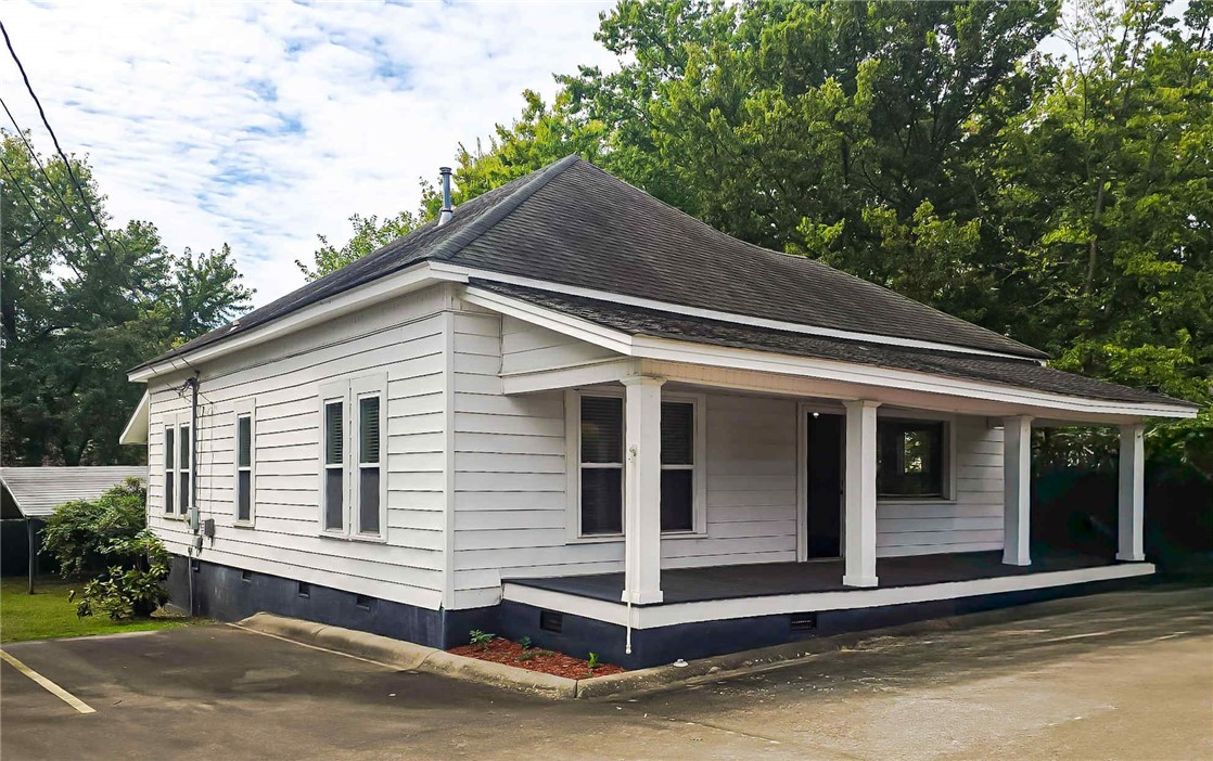 If you are looking for move-in-ready office space in Clarksville, this is it! The building has been professionally updated and well-maintained, serving perfectly as a financial investment office for many years! The updates were completed to complement the character of this building, originally constructed in 1978 - 10-foot ceilings throughout, windows to allow natural light into each room, and some original interior doors remain. Once you enter off the welcoming front porch, there is ample space for a reception area, two large offices, a conference space, and a full kitchen and bathroom. Don't miss out on the opportunity to make this space your own!