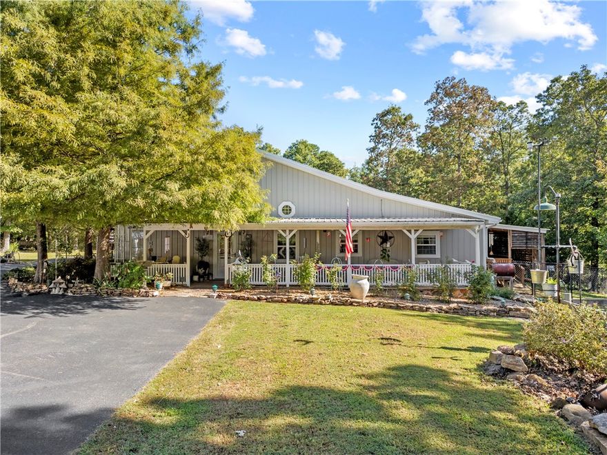 Escape to your dream country home with this stunning 3-bedroom, 3-bath ranch-style residence, nestled on nearly 5 acres of private, wooded, and landscaped grounds. Located just minutes from the Buffalo National River, this property offers a peaceful lifestyle with abundant opportunities for outdoor adventure. An inviting open floor plan features a large living room with vaulted ceilings and beautiful bamboo flooring, newer carpet, and tile flooring. The kitchen boasts custom cabinets, a walk-in pantry, and a well-designed space for both prep and cooking. Stay comfortable year-round, featuring two heat pumps for optimal energy efficiency. Enjoy the tranquility of your surroundings from one of three decks. The property includes landscaped gardens, raised garden beds, and fruit trees, including apple and pear. A detached 2.5-car garage and a garden shed with a carport provide ample storage for vehicles and equipment. Experience local wildlife and nature at your doorstep!