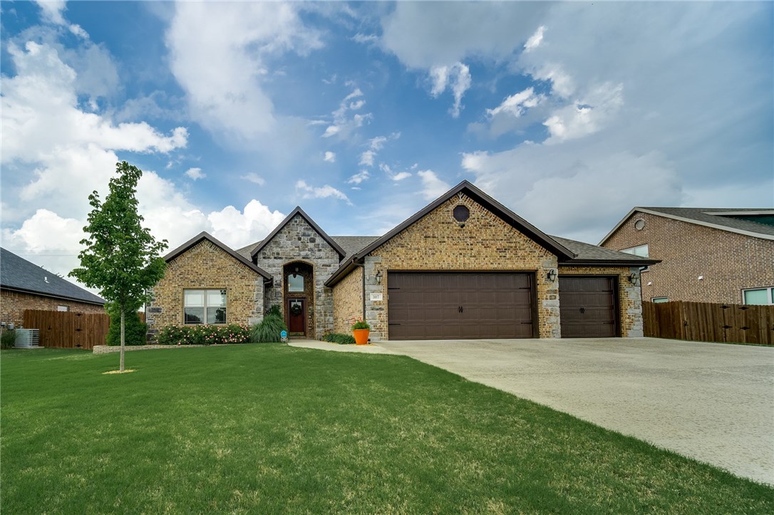 Unbelievable floor plan with tons of upgrades! Quality built brick home with a large kitchen and beautiful stone gas fireplace. Kitchen has tons of soft close cabinets with granite counter tops, stainless steel appliances, double oven and large eat-in kitchen area. Luxurious master bedroom with tons of natural light, crown molding and tray ceiling. Master bathroom with walk-in shower, jetted tub and walk-in master closet that's attached to the laundry room. Enjoy the spacious 900 sq ft deck with great views!