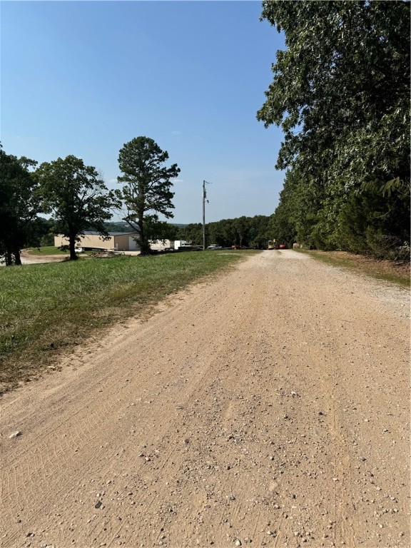 Unleash your wildest fantasies on this explosive 30-acre paradise in Omaha, Arkansas! Hidden behind a shop (not included in sale), this property boasts a newly constructed building pad and extensive trails, perfect for adrenaline-fueled adventures. Whether you dream of a luxurious cabin, permanent residence, or extravagant vacation home, this land offers boundless possibilities. All that's needed are your bold ideas and a well/septic system, with electric conveniently close by. Don't miss this chance to turn your real estate dreams into a thrilling reality!