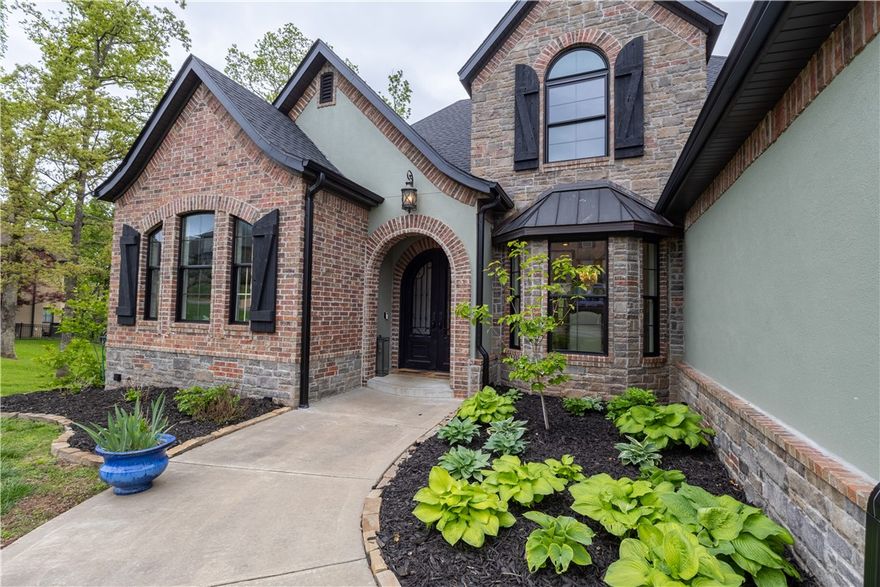 CUSTOM BUILT CHAPEL HILL ESTATE BOASTING INCREDIBLE UPDATES THROUGHOUT!! Fabulous location just 1.4 miles from Crystal Bridges and 2 miles from Downtown Bentonville!! This 3 level home tucked away on a private, treed lot offers a fantastic floor plan with formal dining, private office, 2 living areas, huge eat-in kitchen, full walk-out basement featuring bonus room, theater room, wet bar, game room, bedroom, full bath, office and great storage space! 3 bedrooms, 2 baths and a bonus upstairs. NEW PAINT INSIDE AND OUTSIDE, ALL NEW MASTER BATH, NEW SHOWERS, NEW COUNTER TOPS, NEW CARPET, NEW TILE FLOORING, NEW BATHROOM MIRRORS, PLUMBING FIXTURES, LIGHT FIXTURES AND NEW APPLIANCES, AND MORE! NEW ROOF IN 2025! Beautiful outdoor living spaces w/ spacious deck/balcony and huge covered patio w/ outdoor fireplace and kitchen!