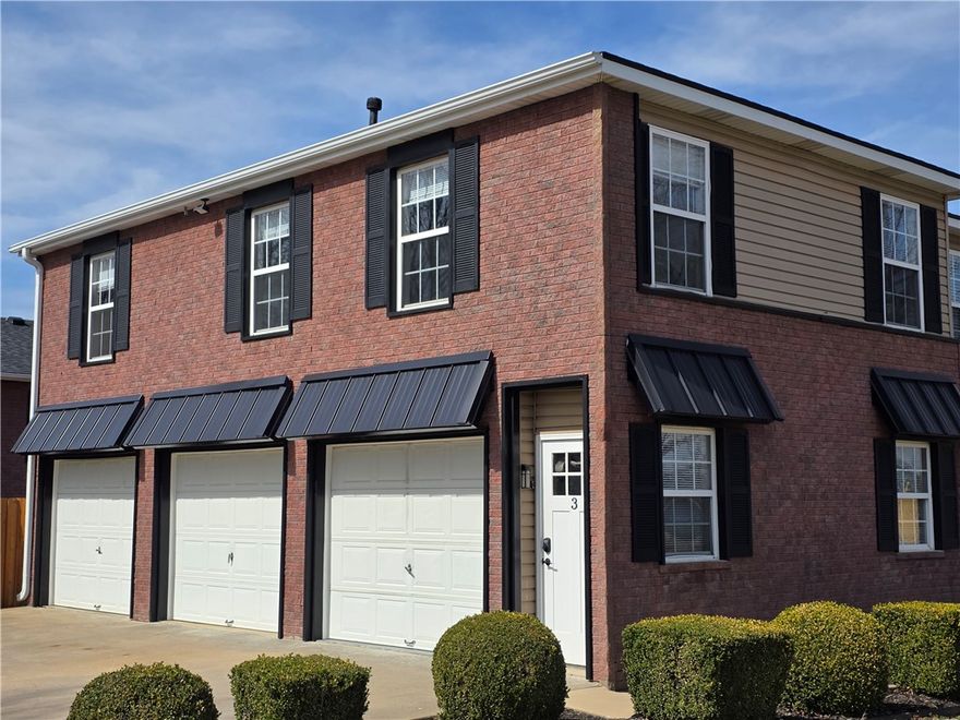 Recently updated luxury townhome ideally located on Moberly Ln between SE 8th St and SE 5th St, only 4 blocks from the new Walmart Home Office, 5 min to Downtown Bentonville Square, and quick access to I-49. This modern residence features stylish finishes, open-concept design, and included appliances — washer, dryer, and refrigerator — making move-in effortless. Enjoy the convenience of low-maintenance living plus access to an on-site multi-purpose sports court for recreation and community connection. Location, lifestyle, and luxury — all in one exceptional opportunity. Includes 1 car garage under unit for easy parking. Also available without garage.