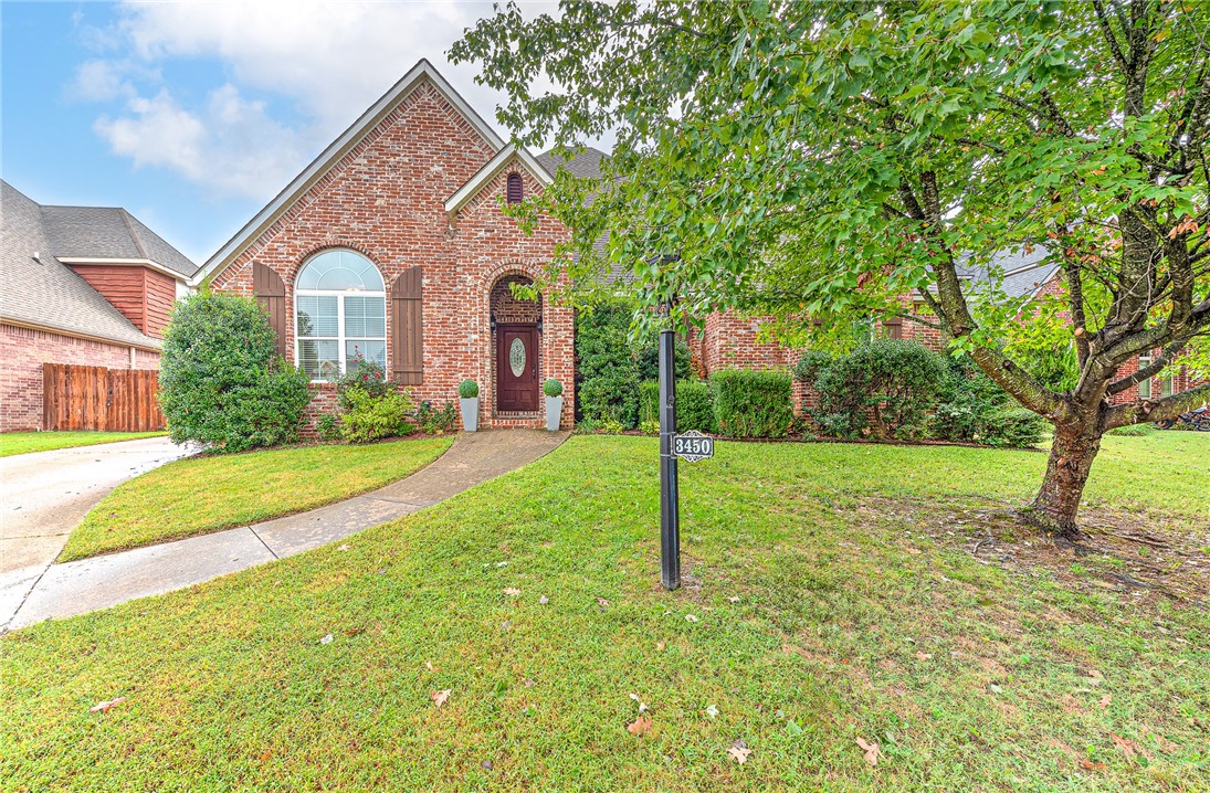 This beautiful home blends warmth and functionality with thoughtful design throughout. The inviting open concept living area features soaring ceilings, crown molding, and an abundance of natural light. The gourmet kitchen showcases rich wood cabinetry, granite countertops, double ovens, and a center island with breakfast bar seating, perfect for entertaining. Upstairs, a flexible bonus space offers room for a home office, workout area, or playroom, complete with an adjoining full bath. The home also includes multiple living and dining options, providing versatility for your lifestyle. Retreat to the private backyard with a covered patio, ideal for outdoor gatherings and relaxing evenings in your hot tub. The side-entry garage and extended driveway offer ample parking and convenience. With its elegant finishes, generous storage, and versatile layout, this property is ready to welcome you home.