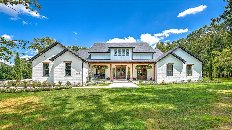 Experience unparalleled luxury in this newly built custom home, nestled on 2 acres in a prime location near trails & the UofA. This prestigious residence seamlessly blends comfort with elegance, offering a heated pool and expansive yard for ultimate privacy and relaxation. With 4 bedrooms, a dedicated office, and a pool room, this home is designed for both intimate gatherings and grand entertaining. The gourmet kitchen features double ovens, quartz countertops, and Energy Star appliances, plus ample storage in large pantry. Enjoy the convenience of a split floor plan and high-end finishes throughout, including built-ins, wood floors and LED lighting. The integrated Sonos audio system and smart lighting create a modern living experience, while the outdoor kitchen, complete with a sink and built-in gas grill, is perfect for entertaining guests. Professionally landscaped grounds with hardwoods and a 3-car garage complete this exceptional home. You won't want to miss this one! Schedule showing today!