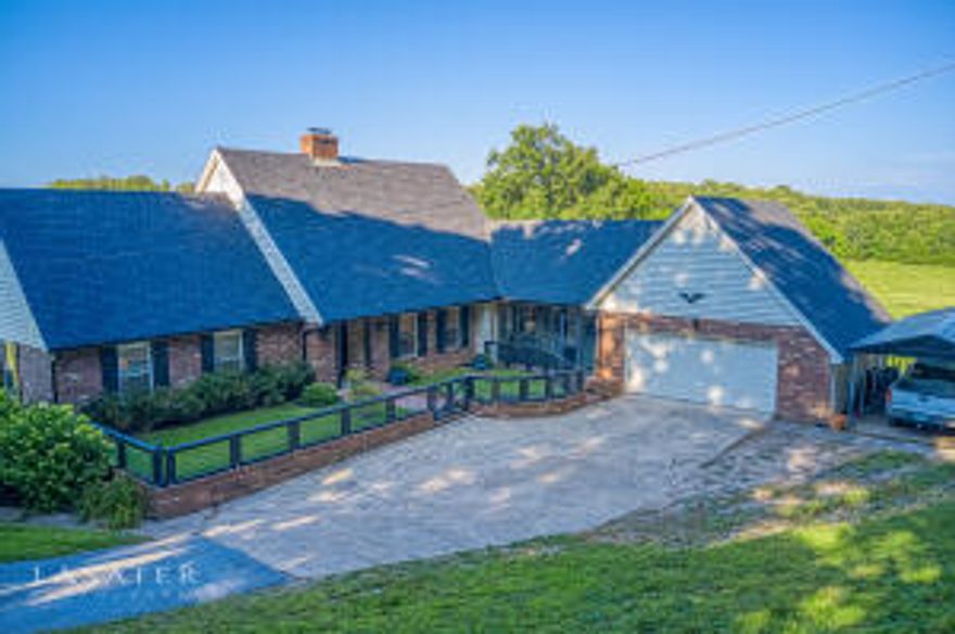 Gorgeous farm in the beautiful Ozarks! You will love the location of this 59.45 ac,m/l, country quiet in the city limits! Amazing views from every room! Approx 30 mins from Branson MO & Tablerock Lake, the Buffalo River National Park, and a premier bass fishing lake, Bull Shoals.   Can be purchased w/additional 21.3 acres.Excellent farm for equine facility or cattle, perimeter fenced and cross fenced with a 40x40 barn w/20x40 equipment shed. Also included is a 14x48 high tunnel hoop house. The stately custom built home has been beautifully remodeled with exceptional craftsmanship and meticulous attention to detail. Main level has master suite, guest suite living room, den , dining , office & sunroom with great view. SEE SUPPLEMENT FOR MORE INFO Sq ft approx