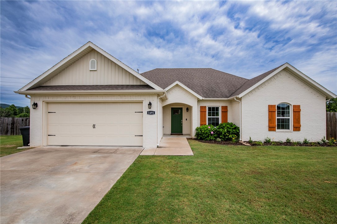 This charming home has a backyard oasis w/ features that are hard to come by. With over 1/3 of an acre, and no neighbors directly behind the home, you feel the neighborhood disappear into views of the tree covered hilltops nearby. Inside, the house has an open split floor plan with a large living room, kitchen, dining area, and bar seating for 5-6. The XL primary suite has a spacious bedroom/bathroom layout with his and hers walk-in closets. New carpet just installed! Over time there have been many updates to this home inside and out, such as the expansion of the patio that runs the length of the house. The back patio is 17'8" deep by 52'5" wide! The backyard also has a garden with raised beds and chapel arches creating a beautiful walk-through trellis all enclosed with an adorable white picket fence. At the far side of the back fence there is an 11' wide gate for easy access to Illinois Chapel (co road 20). There are many more beautiful details that you must see in person to experience it in full.