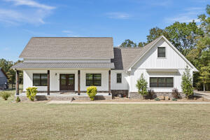 Nestled on over an acre of serene land, this charming 4-bedroom, 3-bath home perfectly balances comfort and style. The split floor plan offers privacy, making it ideal for families or guests. Each bedroom is generously sized, and the large walk-in closets provide ample storage--what a dream for organizing clothes and treasures alike!As you enter, you'll appreciate the warmth of the fireplace, inviting you to cozy up on chilly evenings. The heart of the home seamlessly flows into the spacious living area, ideal for entertaining friends or spending quality time with loved ones. Natural light floods the space, creating an uplifting atmosphere.Let's set up a showing today!