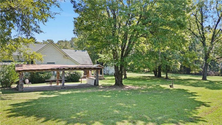 Quaint farm house Situated on 80 +/- acres near town. This 3-bedroom, 1.5-bath home is just 2 miles from town. The property offers the rare convenience of city sewer, city water, and electricity while providing expansive acreage for unmatched privacy and future use. Features include a large barn, a beautiful running creek along the far end of the property, and abundant amount of pasture land great for cutting hay or letting your cattle or horses graze. This property has a perfect amount of woods to be able to hunt right off your back porch or walk down to the creek and catch fish all day! Schedule a appointment and see this once in lifetime property for yourself