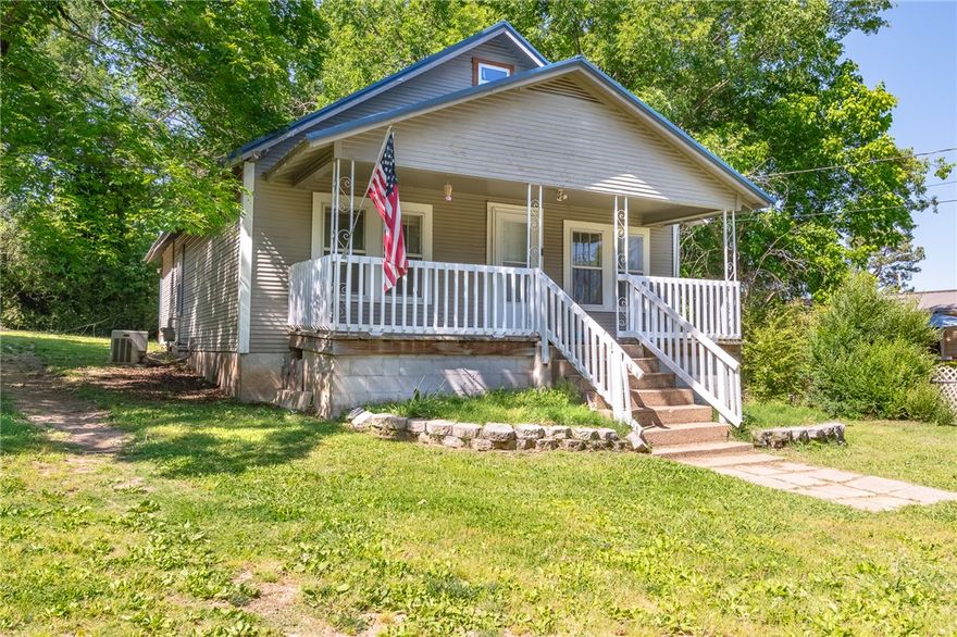 Welcome to this charming 3-bedroom, 1-bathroom home perfectly situated on a spacious 0.51-acre lot in the heart of Harrison. Boasting approximately 1,520 sq. ft. of living space, this residence features beautiful hardwood flooring and a functional layout. The kitchen comes equipped with a dishwasher, range, and refrigerator, while the central cooling and electric heating ensure year-round comfort. Looking for extra storage or a workshop? You’ll appreciate the detached garage and convenient carport. Outside, the large level lot provides plenty of room for gardening, play, or future expansion. Located just steps from Forest Heights Elementary, this property combines a peaceful neighborhood feel with quick access to local amenities. Whether you’re a first-time buyer or looking for a solid investment, this home is a must-see!