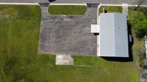 This HUGE 8400 sf m/l multi-purpose, two-story steel building sits on 3 acres m/l in the middle of Russellville near James Park and the new location of the Latimore House. The Bridge Church has occupied this property for many years and completed many improvements - new flooring downstairs, the construction of a new stage and loads of storage are a few examples. Within the building there are two offices, four classrooms, a commercial kitchen, two full bathrooms, and a large sanctuary that can hold approximately 300-350 people, has a full stage with baptistry and storage by the stage. A great space for another church, but would also work well as a school, community building, office space, daycare or with some imagination multi-unit rental - So many ways to utilize this great space!