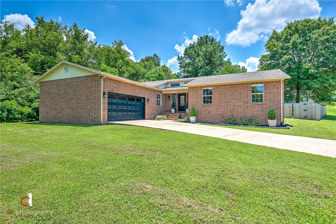 Home sits on almost .45 acre, way back off of Mission Blvd. Beautiful mature trees surround the large fenced in backyard. Pergola that use to cover a hot tub. Enter into a light and bright home with updated light fixtures. Real hardwood floors flow throughout the home. Everyone's favorite updated white kitchen with gas range and farmhouse sink with plenty of granite countertop space. Nice size bedrooms and baths. Home also includes a flex room perfect for a play room for young families or office space or a formal dining room. Mission Blvd trail in the works to connect to the Razorback trail see fayetteville-ar.gov/3919/mission-blvd-corridor. showings will be scheduled through showingtime and property will show Thursday- Sunday night. All offers submitted by noon on Monday and please put a Monday 7pm expiration time on the offer. Decision will be made Monday night.