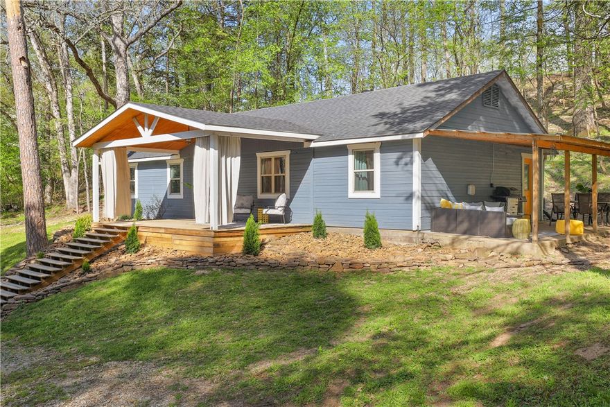 Welcome to your dream retreat or next investment gem—with stunning Beaver Lake views! This beautifully remodeled modern farmhouse sits on 1.66 acres, offering peace, privacy, & picturesque surroundings. Step inside to a charming eat-in kitchen complete w/a spacious pantry, hand-carved countertops, a classic farmhouse sink, & stylish finishes that blend function & flair. The thoughtful layout includes a cozy living room, a versatile bonus/game room, & a spacious mudroom/laundry area. Throughout the home, character abounds - like shiplap walls, subway tile, sliding barn door, & French pantry door. Enjoy morning coffee or unwind in the evening on 1 of 2 covered porches. Oversized front porch offers breathtaking lake views & the perfect backdrop for those quiet, peaceful moments. Add'l highlights include newer electrical, HVAC, roof, windows, fresh interior paint, & professional landscaping. RD loan eligible. Can be purchased fully furnished for additional fee—move-in ready or rental-ready from day one!
