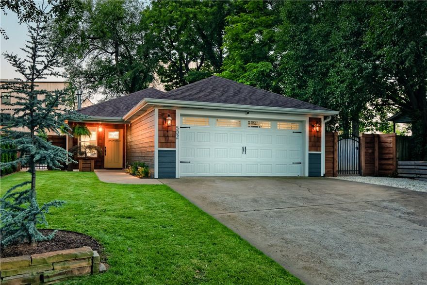 Welcome to this wonderful home in the heart of Downtown Bentonville with direct access to the Razorback Greenway across the street. The modern charm of the home is complete with exquisite upgrades including new lighting and light fixtures, a new roof in 2021, pecan hardwood and tile floors, custom shelving, stained cedar shingles, and so much more. An open, yet private feel of the home allows space for everyone. The flow from the front entry through the living room and kitchen to the back of the home is seamless. The primary ensuite features heated floors, a heated towel rack, and a smart toilet/bidet in the bathroom. A peaceful back patio space includes extensive landscaping with an updated sprinkler system, stone wall, side yard dog run, and a gated backyard. With all of the stunning upgrades and incredible location, this is an amazing opportunity to own a home in Downtown Bentonville!