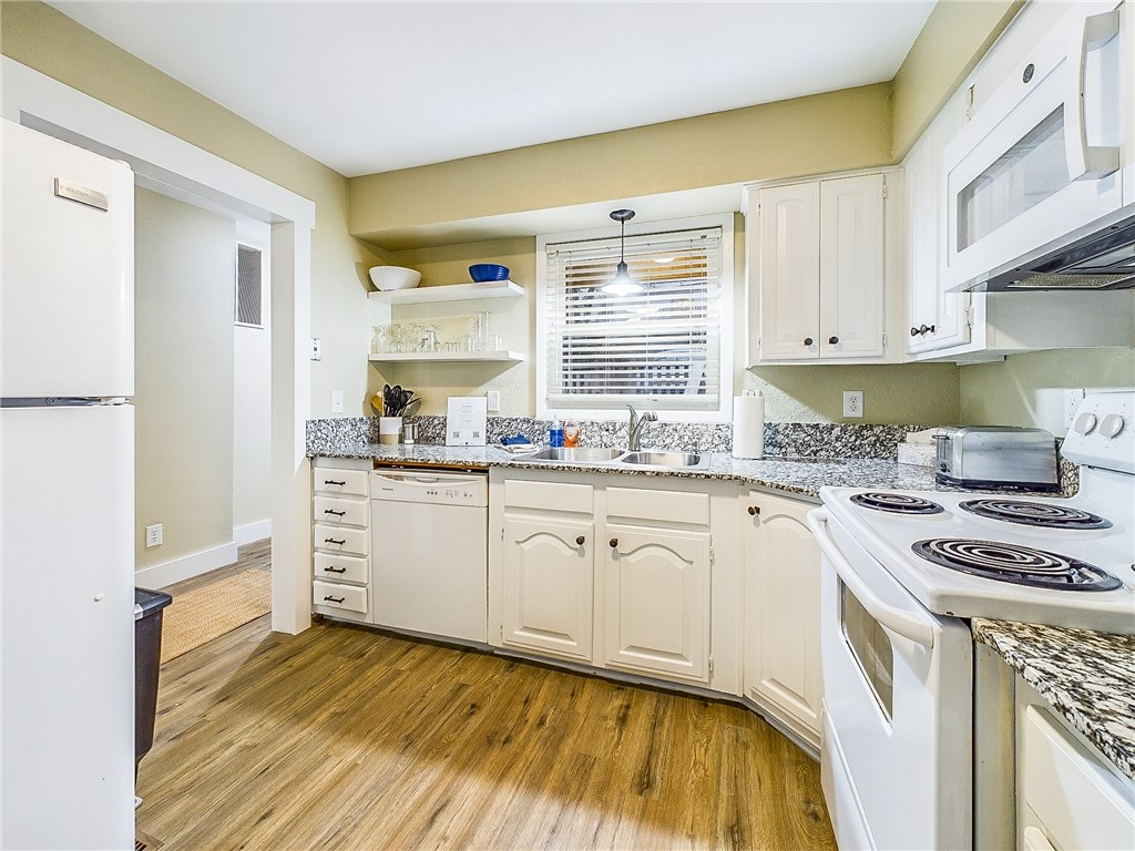 Experience Bella Vista, a charming 2-bedroom, 1.5 bath, nestled behind the Tunnel Vision trail. This ideal location offers easy access to the Little Sugar Trail system for outdoor enthusiasts. The first floor features a spacious common area, a cozy kitchen & a convenient .5 bath. The primary bedroom on the upper floor boasts a full bath, a laundry area, and a spare bedroom. One of the homeās highlights is its spacious common area, perfect for relaxing & enjoying the outdoors. The scenic double-deck patio provides a peaceful & nature-filled living experience. The seller has completed all updates to the home, including flooring, sheetrock repair, paint, and trim, in early 2024. The property offers two convenient outdoor parking spaces for the unit. Itās conveniently located near Highway 71, providing easy access to Bentonville. The home currently features furniture that can be left in place or removed. Itās close to Highway 71 and provides easy access to Bentonville.