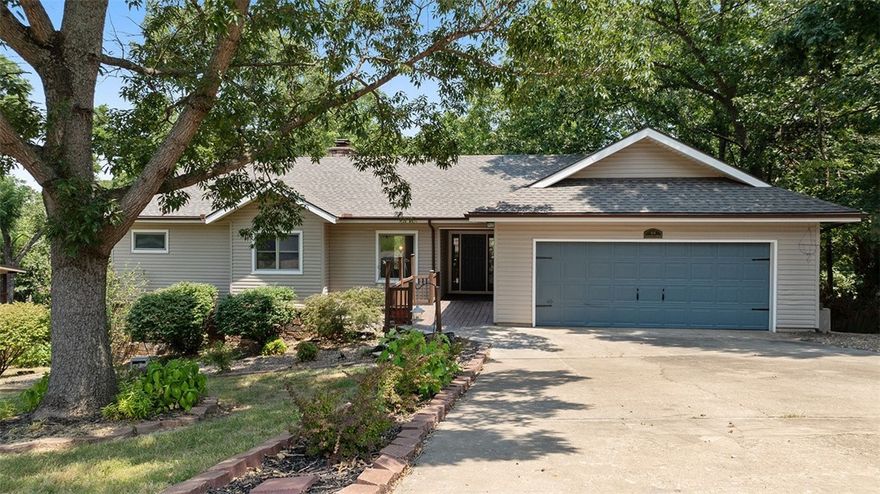 PRICE REDUCED! Two fireplaces, two living areas, and tons of bonus space—this one has room to stretch out and make it your own. Upstairs offers 2 beds and 2.5 baths, while downstairs includes another bedroom and bath plus two flex spaces. One’s large with outdoor access—ideal for a workshop, gym, game room, or 4th bedroom. The other’s smaller —great for a home office, theater room, or just climate-controlled storage. Updates include a brand new roof, fresh paint, new tile, carpet, lighting, fixtures, and quartz/granite counters throughout.  The basement level could potentially be partitioned off to use as short term rental space. All of this is just a stone's throw from the Loch Lomond marina, Loch Lomond Recreation Complex and K-9 park, and Scottsdale Golf Course!