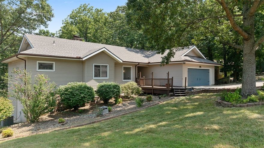 PRICE REDUCED! Two fireplaces, two living areas, and tons of bonus space—this one has room to stretch out and make it your own. Upstairs offers 2 beds and 2.5 baths, while downstairs includes another bedroom and bath plus two flex spaces. One’s large with outdoor access—ideal for a workshop, gym, game room, or 4th bedroom. The other’s smaller —great for a home office, theater room, or just climate-controlled storage. Updates include a brand new roof, fresh paint, new tile, carpet, lighting, fixtures, and quartz/granite counters throughout.  The basement level could potentially be partitioned off to use as short term rental space. All of this is just a stone's throw from the Loch Lomond marina, Loch Lomond Recreation Complex and K-9 park, and Scottsdale Golf Course!