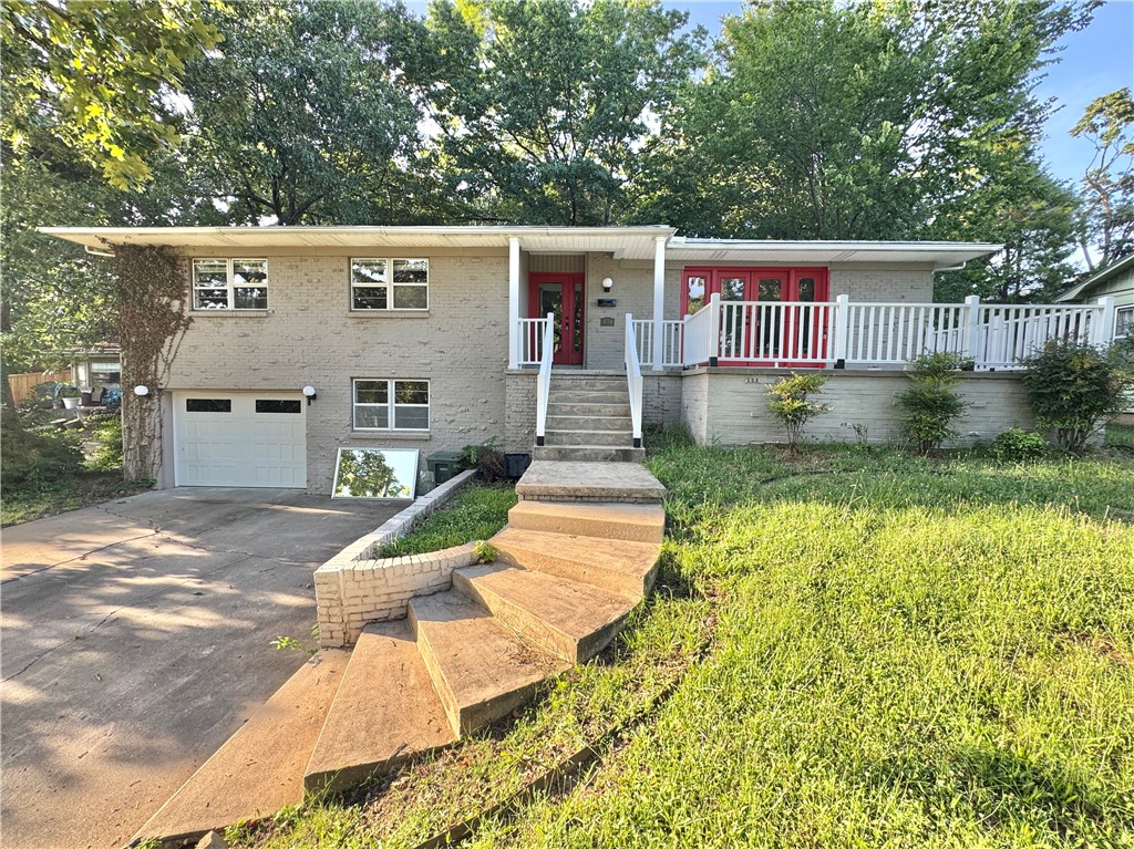 Check out this beautifully updated 3 bed, 2 bath home overlooking Wilson Park! This home is truly a must-see. Home has had several updates throughout. Spacious living room with new carpets, fresh paint, new tile in bathrooms, hardwood throughout kitchen and spare bedrooms. This home features a nice bonus room in the basement. Single car garage that flows into oversized laundry/utility space with new flooring. Ample storage and built-ins throughout. Great front porch & large back deck overlooking tree-shaded backyard. Minutes to Fayetteville Square, Dickson St, U of A, shopping & dining!