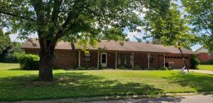Everything important has been updated! Over 2200 s.f., 3 bedroom 3 bath brick in Faith Addition. New flooring throughout, custom eat-in kitchen with double ovens & pro gas range, and den with wet bar and fireplace. Nice roomy back yard with concrete back patio. Hall bath includes a walk-in closet. Plus, a 2 car garage, what more do you need? Fiber optic internet? It will be available September 2020. Call for your show today!