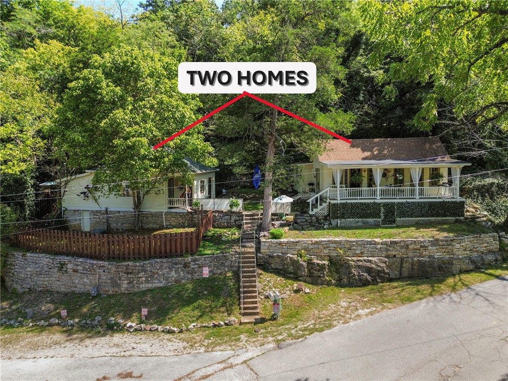 Discover a rare opportunity in the vibrant and eclectic town of Eureka Springs. This offering includes two adjoining properties with a shared courtyardāone dating back to 1901 and the other built in 1917āblending historic charm with modern comforts. 19 Jackson St is a 1-bedroom, 1-bath retreat providing peaceful serenity, with a spacious bath complete with a cast-iron tub, tiled shower, and stackable washer/dryer. Flexible living space allows for an office, sitting room, or even the option to add a second bedroom. Flint is bed/1 also a 1bed/1 bath that delights with built-in bookcases, whimsical wall murals, and apricot-toned accents. 17 Flint St has an incredible deck across the front that looks over the Grand Central. The inside is remarkably well done with custom wood work, luxurious paint colors and beautiful wood laminate flooring. See attachment for features of each property.