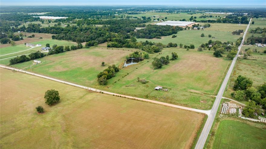Embrace the beauty of 39.06 acres of true country living! This exceptional property is fully fenced and cross-fenced, ideal for livestock and ready for agricultural use. A designated paddock includes a small barn with attached awning—perfect for shelter, storage, or equipment. The land is mostly level and open, offering expansive grazing areas with a balance of space and usability. A peaceful pond enhances the setting, providing both a reliable water source for livestock and a serene spot to enjoy country views. With water already on site, the property is primed for development—whether building a custom home, starting a hobby farm, or expanding a cattle operation. The wide-open layout, combined with privacy and tranquility, offers endless possibilities. Seller is open to dividing the property in half, subject to county approval and added cost, giving buyers flexibility. This rare opportunity blends function with natural beauty—an ideal setting for your dream country lifestyle.