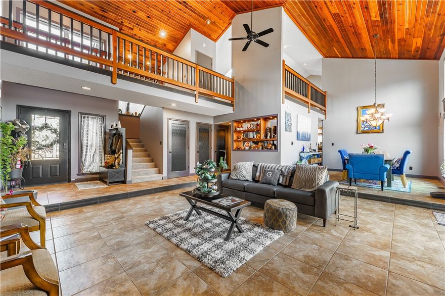 Exceptional 3-bedroom home transforms living with over $100,000 in recent upgrades, offering unparalleled location and amenities. Situated on a premium acre, this is the ONLY property backing directly to the exclusive HOA neighborhood pool & tennis courts, providing breathtaking city views from a thoughtfully designed open living space.  Accessible to bustling downtown Springdale, The Jones Center, Razorback Greenway, and more. Complete systems updates with new roof, tankless water heater, HVAC system, whole-home monitoring, fresh paint, water filtration, and professional landscaping. Featuring a versatile "man cave" and large upstairs bonus room w/ wet bar. A large primary suite adds to the appeal w/ walk-in closet that can be reverted to 4th bedroom. The fenced backyard offers direct pool access and views—a unique convenience no other neighborhood home provides. This property isn't just a residence; it's an investment in quality, location, and lifestyle that cannot be duplicated elsewhere.