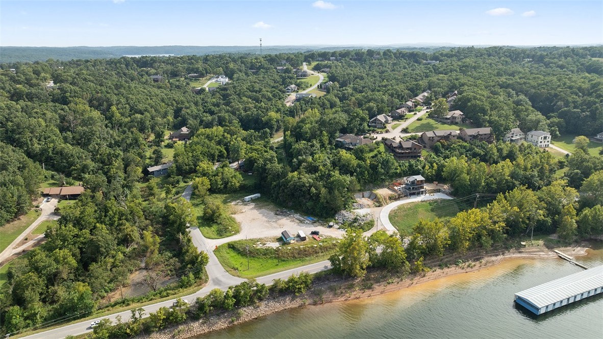 Fantastic .53 acre lot located just before the Hwy 12 bridge and only a 10-minute drive to Downtown Rogers. The property is also very close to a public boat launch, making it ideal for lake access and recreation. This parcel sits adjacent to the lot with the Cliff House residence and offers its own potential for building. The driveway serves as an access easement for both parcels. A rare opportunity to secure a buildable lot in a highly desirable location near the lake and amenities. Approved borrowers will receive a closing cost credit of 1% of the loan amount up to $5,000 on their Closing Disclosure on their loan closing with Envoy Mortgage Branch NMLS #2659248 and Branch NMLS #2579798. Lot also included in MLS #321499