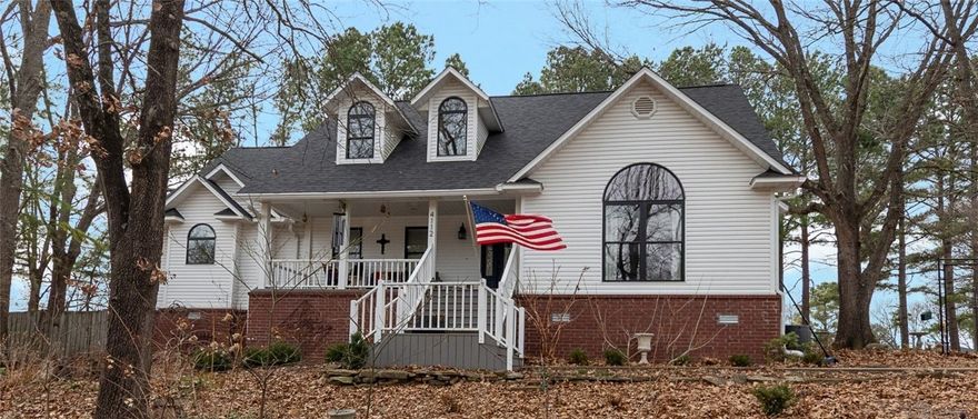 Experience the perfect blend of peaceful country living and everyday convenience in this beautifully updated home, located just minutes from the new Walmart Home Office, vibrant downtown Rogers, and many local attractions.  This move-in ready home features numerous recent upgrades, including new windows (2022), a brand-new roof with impact resistant shingles (2024), fresh interior paint (2024), refurbished deck (2024), and new flooring on the stairs and upstairs (2024). The fireplace has also been upgraded to a vented stove.  Upstairs, the spacious bedroom offers flexibility and could easily serve as a bonus room, home office, or media space.  Enjoy your morning coffee on the inviting front porch or unwind on the back deck overlooking a peaceful setting. The home is also equipped with a generator connection to the main panel for added peace of mind.  Thoughtfully updated, ideally located, and priced to sell quickly — this is one you don’t want to miss!