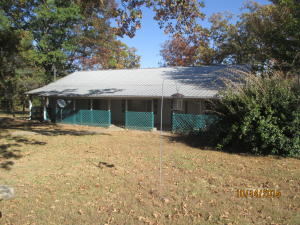 Beautiful home sitting on Woods Mtn! Own your own piece of Ozark Mountain Magic. The property contains the old Judge Patterson Barn, and includes a potentially amazing view off Woods Mountain. 9 acres, home, & barn at Ozone. Heat pump, front & back porches, city water plus old well. Kitchen with island, pantry, and all appliances including washer/dryer! Excellent condition. WHAT A VIEW!