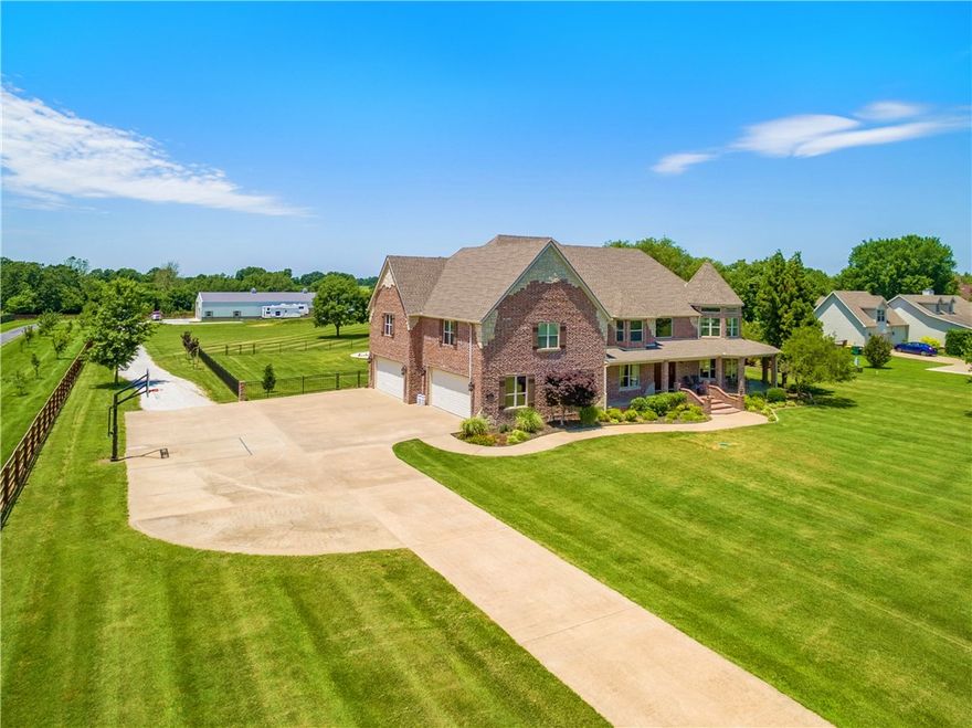 An absolutely beautiful dream come true on 3.19 acres! Everything you want and more. A gorgeous, spacious home including chef's kitchen with large island, grand entry, impressive master with large en suite. High end finishes throughout. Spaces include: bonus, office, large laundry, living and family spaces, eat-in kitchen and dining. Indoors or outdoors is an entertainer's dream with a beautiful wrap around covered porch! Brand new 1 year ago are the gorgeous pool, pool house with its own kitchenette and full bath perfect for guest or inlaw quarters. New 2 years ago is the 4,800 SF shop with 4 garage doors one of which is for RVs & large storage loft. Room to spread out for you and for your horse(s) in your own backyard. You could not ask for more. Schedule your private showing today.