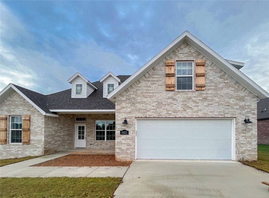 Brand new all brick home in the heart of NWA! Within walking distance to Shaw park and easy access to I-49 and all that NWA has to offer! This beautiful home features 4 bedrooms, 2 full baths, a huge bonus/media room, covered front porch, open/split layout, large kitchen island, gas range, quartz countertops, custom built cabinets all the way to ceiling, vaulted ceiling in master, hardwood floors, high end trim package, and so much more! Home is convenient to I-49, HWY 112, parks, trails, shopping, dining, and more! Photos of same floor plan at different location.  Some features and actual finishes may vary.  Home is being built with an estimated completion date of June 2025.  Get in now to pick your interior finishes!